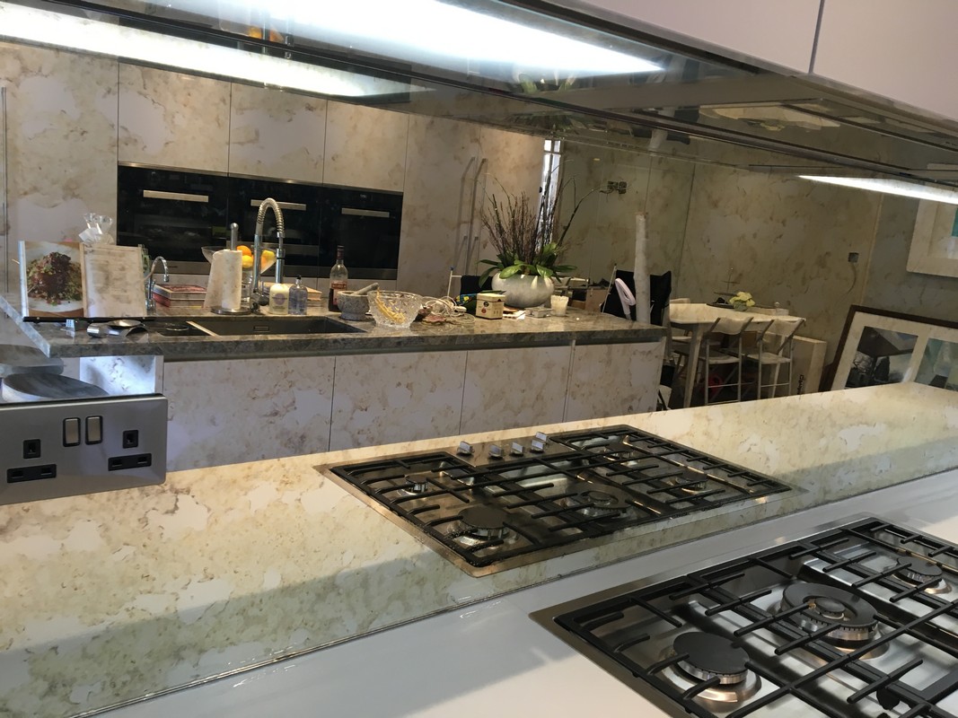 Mirror glass splashback in Holland Park luxury kitchen